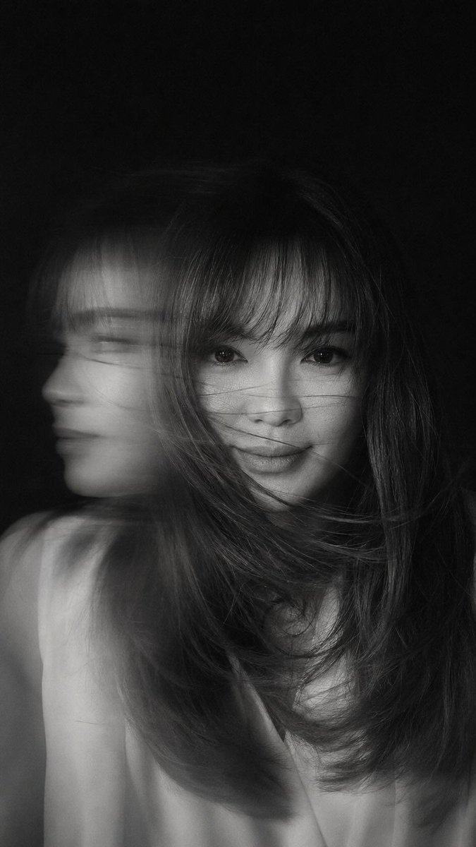 A hyper-realistic, cinematic black-and-white portrait of a w