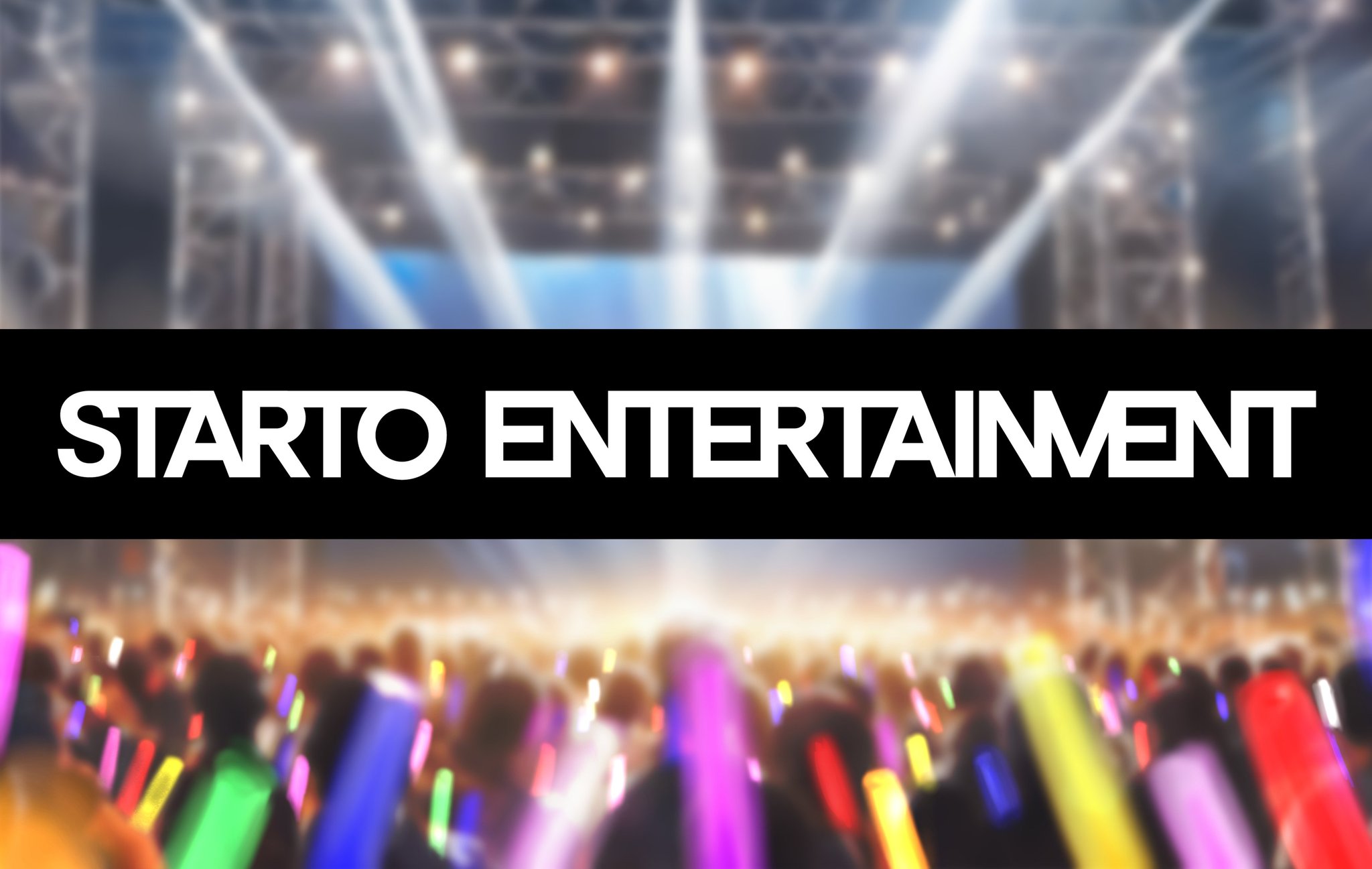 A blurred image of lightsticks at a concert, dreamy atmosphe