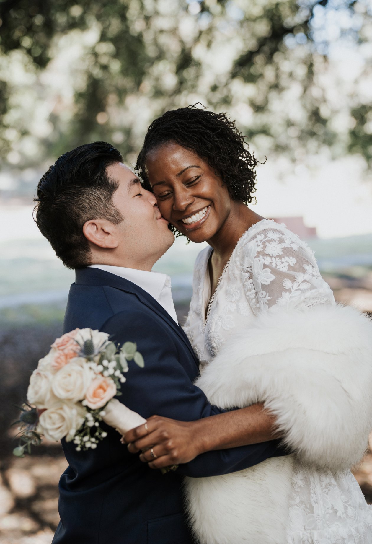 kawaii chibi art of a black bride and Asian groom in the sty