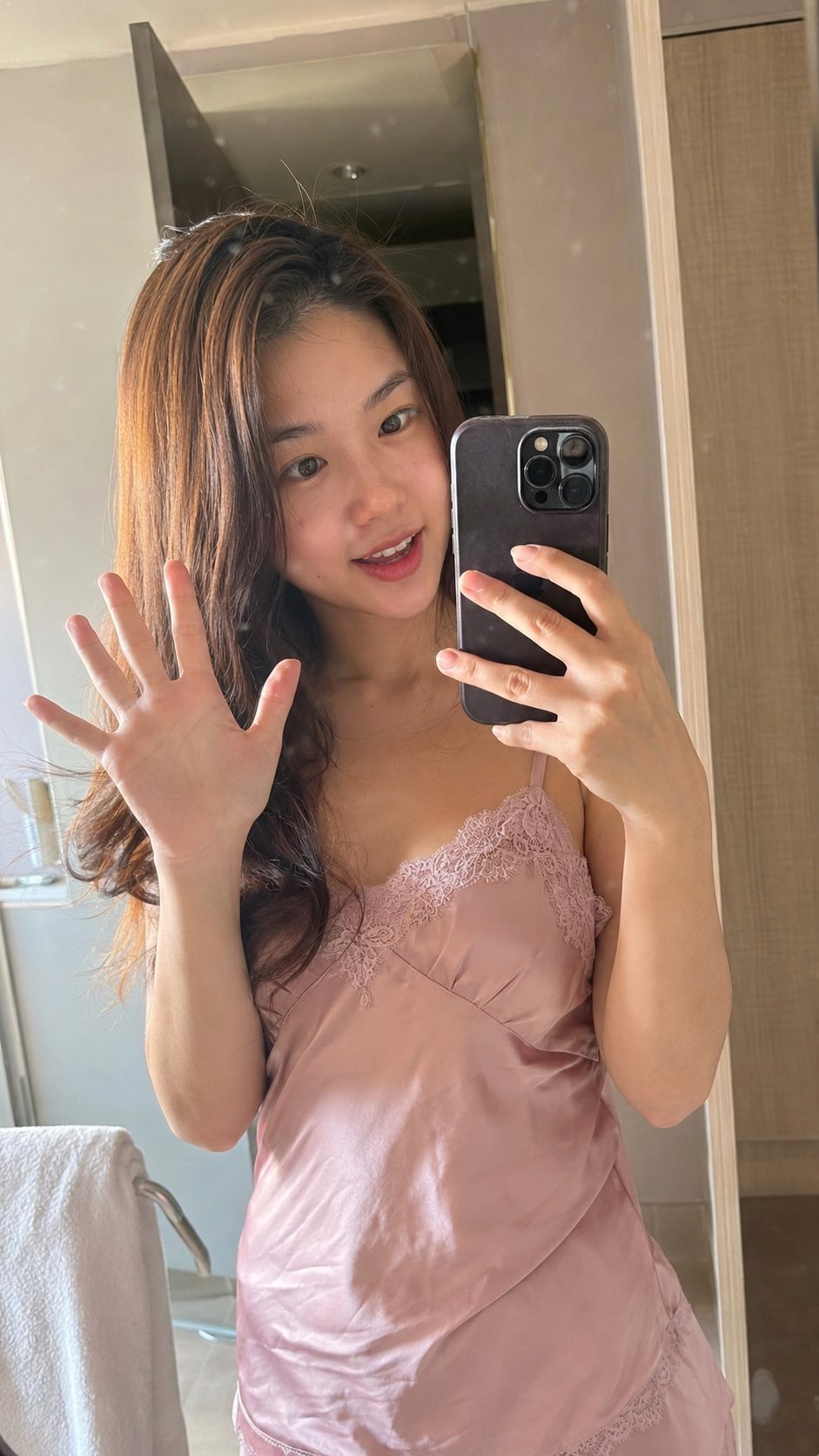 Photorealistic candid vertical smartphone mirror selfie of a