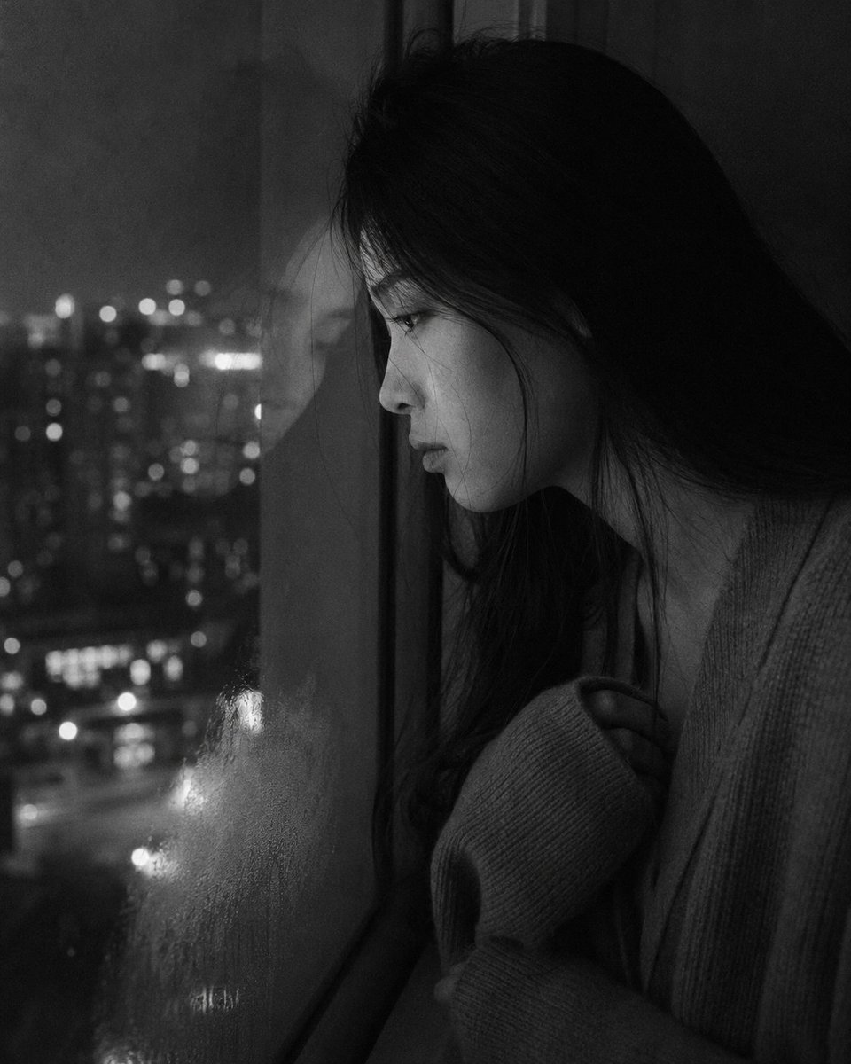 Medium close-up portrait, 85mm, a young East Asian woman in 