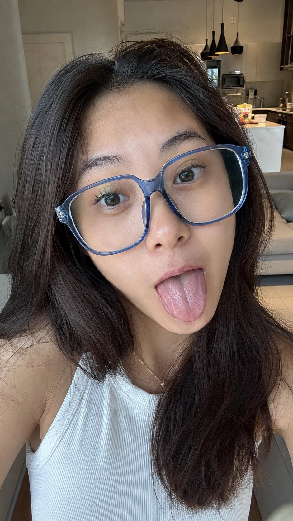 Photorealistic candid vertical smartphone selfie of an adult