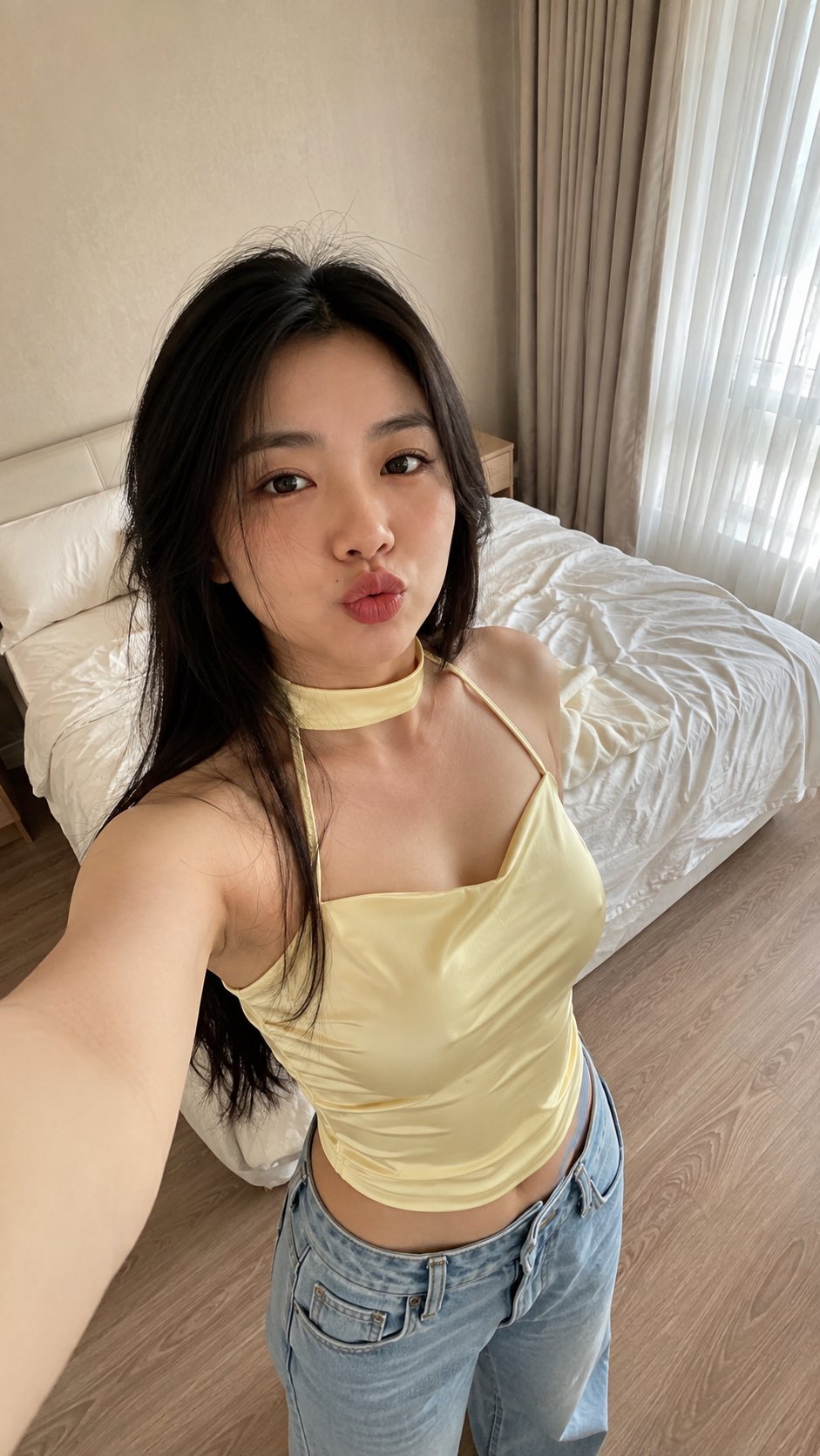 Photorealistic vertical smartphone selfie of an adult East A